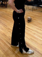 Load image into Gallery viewer, Black snap-leg track pants with silver closures and elastic waist — House of 423 Geneva IL