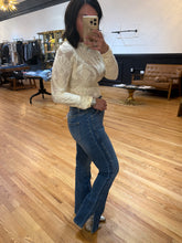 Load image into Gallery viewer, Medium wash high-rise flare jeans with side slit hemline – House of 423, Geneva IL

