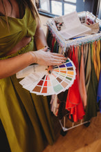 Load image into Gallery viewer, Color analysis session at House of 423 in Geneva IL, showing an Autumn seasonal color fan of swatches used to find your best colors
