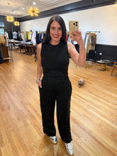 Load image into Gallery viewer, Black snap-leg track pants with silver closures and elastic waist — House of 423 Geneva IL
