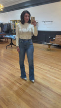 Load and play video in Gallery viewer, Medium wash high-rise flare jeans with side slit hemline – House of 423, Geneva IL
